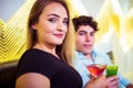 Portrait of couple holding cocktail glasses Royalty Free Stock Photo