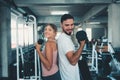 Portrait of Couple Love in Fitness Training With Dumbbell Equipment., Young Couple Caucasian are Working Out and Training Together