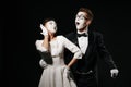 Portrait of couple mime on black background. Royalty Free Stock Photo