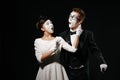 Portrait of couple mime on black background. Royalty Free Stock Photo