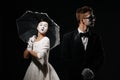 Portrait of couple mime on black background. Royalty Free Stock Photo