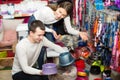Portrait of couple purchasing pet bowls in petshop