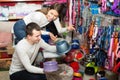 Portrait of couple purchasing pet bowls in petshop