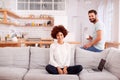 Portrait Of Couple Relaxing On Sofa At Home Looking At Laptop Together Royalty Free Stock Photo