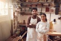 Portrait Of Couple Running Bespoke Pottery Business Working In Ceramics Studio Together Royalty Free Stock Photo