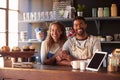 Portrait Of Couple Running Coffee Shop Behind Counter Royalty Free Stock Photo