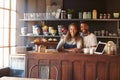 Portrait Of Couple Running Coffee Shop Behind Counter Royalty Free Stock Photo