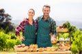 Portrait of couple selling vegetables