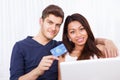 Portrait Of Couple Shopping Online At Home Royalty Free Stock Photo