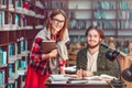 Portrait of Couple of Students in Library Royalty Free Stock Photo