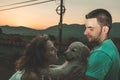 Portrait of a couple with their adorable puppy dog Royalty Free Stock Photo