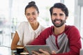 Portrait of couple using digital tablet in cafe Royalty Free Stock Photo