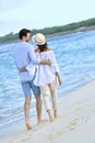 Portrait of couple walking on the beach at sunset Royalty Free Stock Photo