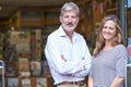 Portrait Of Couple Who Own Bookshop Outside Store