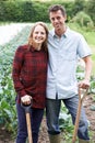 Portrait Of Couple Working In Organic Farm Field Royalty Free Stock Photo