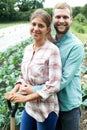 Portrait Of Couple Working In Organic Farm Field Royalty Free Stock Photo