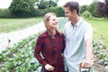 Portrait Of Couple Working In Organic Farm Field Royalty Free Stock Photo