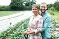 Portrait Of Couple Working In Organic Farm Field Royalty Free Stock Photo