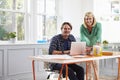 Portrait Of Couple Working Together At Desk In Home Office Royalty Free Stock Photo