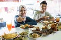 Portrait of the couple young eating dish