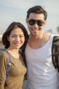 Portrait couples of younger asian man and woman toothy smile wit