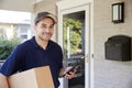 Portrait Of Courier With Digital Tablet Delivering Package Royalty Free Stock Photo