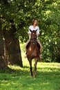 Portrait cowgirl with bay saddle horse Royalty Free Stock Photo