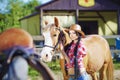 Portrait cowgirl in western style with hors. Royalty Free Stock Photo