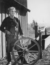 Portrait of craftsman with wooden wheel