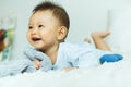 Portrait of a crawling baby on the bed in her room Royalty Free Stock Photo