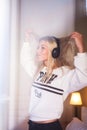 Portrait of crazy happy girl with headphones listening to rock music. Royalty Free Stock Photo