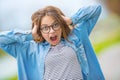 Portrait of crazy happy smilling teenage young girl with glasses Royalty Free Stock Photo