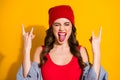 Portrait crazy positive cheerful wild teen girl youth enjoy pank concert weekend make horned symbol fingers show tongue