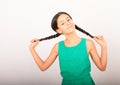 Portrait of crazy pretty girl holding braids Royalty Free Stock Photo