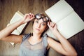 Portrait of crazy student girl in glasses with books and cockroaches, concept of modern education people, lifestyle Royalty Free Stock Photo