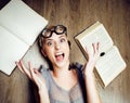 Portrait of crazy student girl in glasses with books and cockroaches, concept of modern education people, lifestyle Royalty Free Stock Photo