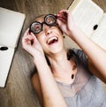 Portrait of crazy student girl in glasses with books and cockroaches, concept of modern education people, lifestyle Royalty Free Stock Photo