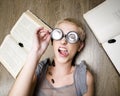 Portrait of crazy student in glasses with books and cockroaches Royalty Free Stock Photo