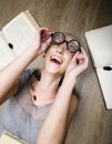 Portrait of crazy student in glasses with books and cockroaches Royalty Free Stock Photo