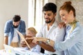 Portrait of creative business people team working together and smiling in office. Royalty Free Stock Photo