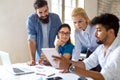 Portrait of creative business people team working together and smiling in office. Royalty Free Stock Photo