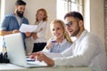 Portrait of creative business people team working together and smiling in office. Royalty Free Stock Photo