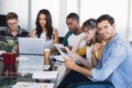 Portrait of creative businessman with team working at office Royalty Free Stock Photo