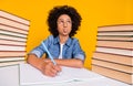 Portrait of creative clever minded girl writing essay task subject pout lips isolated over bright yellow