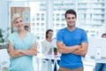 Portrait of creative team with arms crossed in office Royalty Free Stock Photo