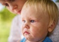 Portrait of a crying little boy who is being held Royalty Free Stock Photo