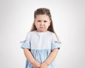 Portrait of crying little girl on grey background Royalty Free Stock Photo