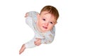 Portrait of a crying toddler boy sitting on the floor, isolated on a white b Royalty Free Stock Photo