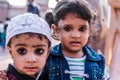 Portrait of cure children facing camera at Jama Masjid, Delhi, I