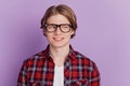 Portrait of curious creative nice guy look empty space toothy beaming smile on purple background